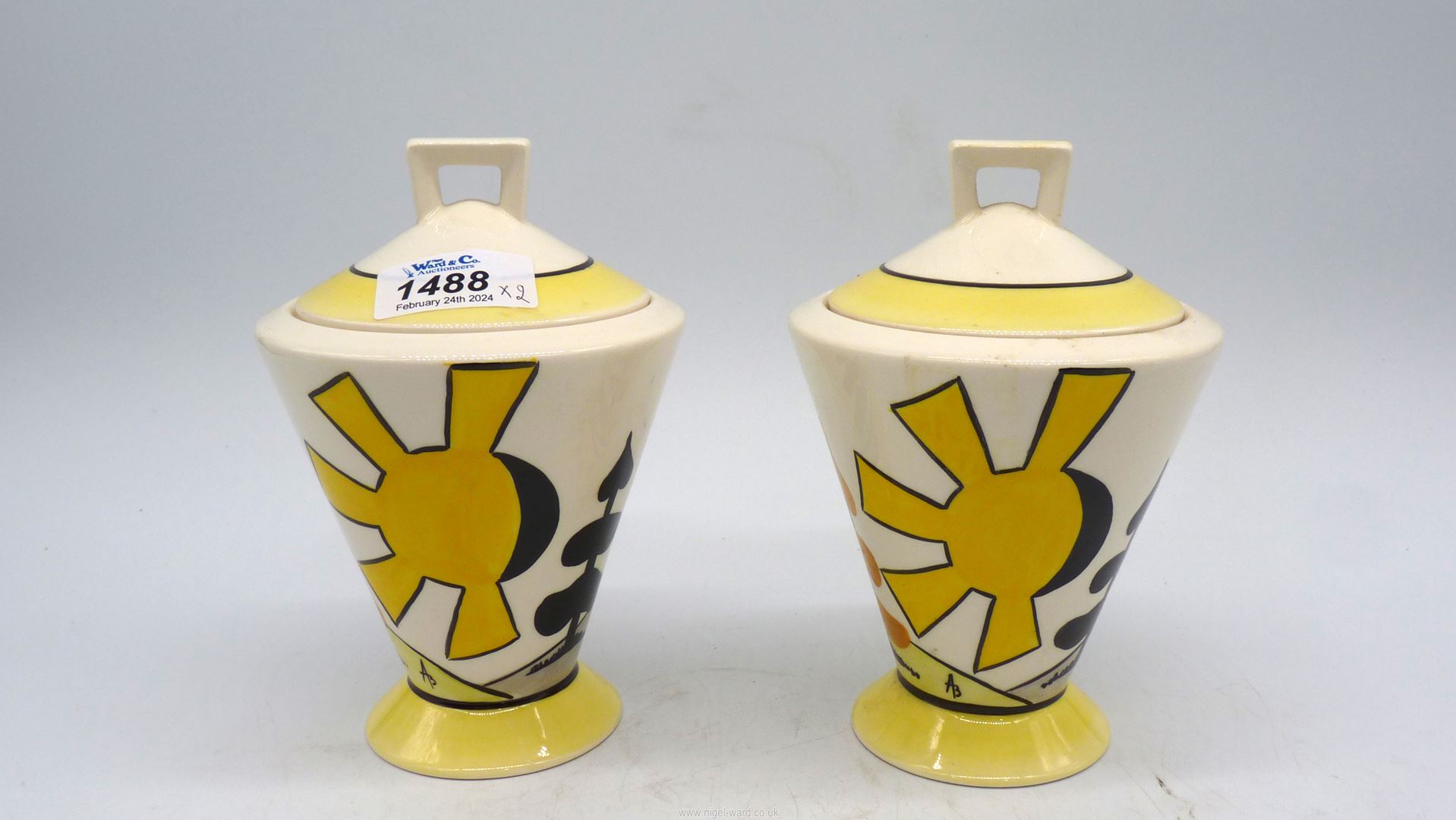 A pair of Elements of Fire lidded Pots with Day and Night pattern, 6 1/2" tall.