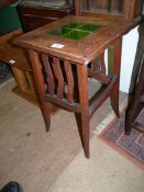 A square arts and crafts Occasional Table/Jardiniere Stand having a green tile inset top,