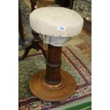 A Mahogany pedestal piano stool (needs re-upholstering), 23" tall.