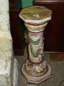 A large Italian Capo di Monte Pedestal stand with raised decoration of figures in a Bacchanalian