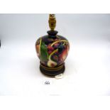 A Moorcroft 'Queens Choice' pattern table lamp in baluster form, 10 1/2" tall.