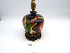 A Moorcroft 'Queens Choice' pattern table lamp in baluster form, 10 1/2" tall.