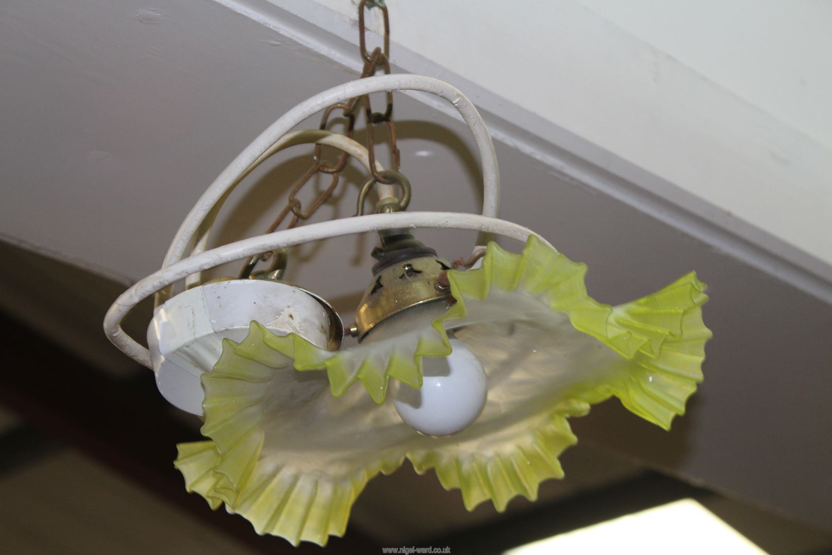 A vintage ceiling shade to white to yellow frosted glass with frilled edges, 10'' diameter.