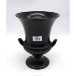 A large Wedgwood Campana shape vase with a half ribbed body, shell shape handles, in soft black,