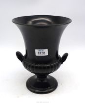 A large Wedgwood Campana shape vase with a half ribbed body, shell shape handles, in soft black,