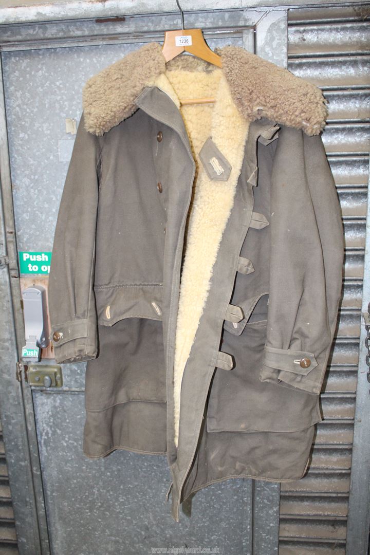 A Swedish Army coat having sheep fleece lining.