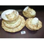 A Queens China teaset, six each cups, saucers and tea plates,