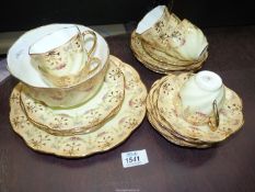 A Queens China teaset, six each cups, saucers and tea plates,