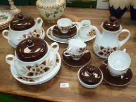 A quantity of Winterling tea and dinnerware in brown floral pattern on white ground.