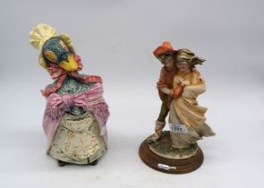 A signed Italian porcelain figure of a couple with a lamb and a Beatrix Potter style duck cookie