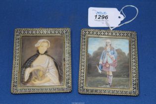 A pair of miniature Watercolour portraits in ornate openwork metal frames;