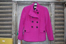 A ladies size 8 double breasted Precis jacket with funnel collar in cerise,