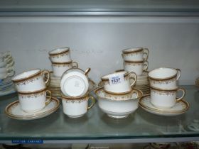 An Aynsley tea set for twelve, cups, saucers and tea plates, two bread and butter plates,