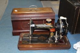 A Frister & Rossmann hand sewing machine.