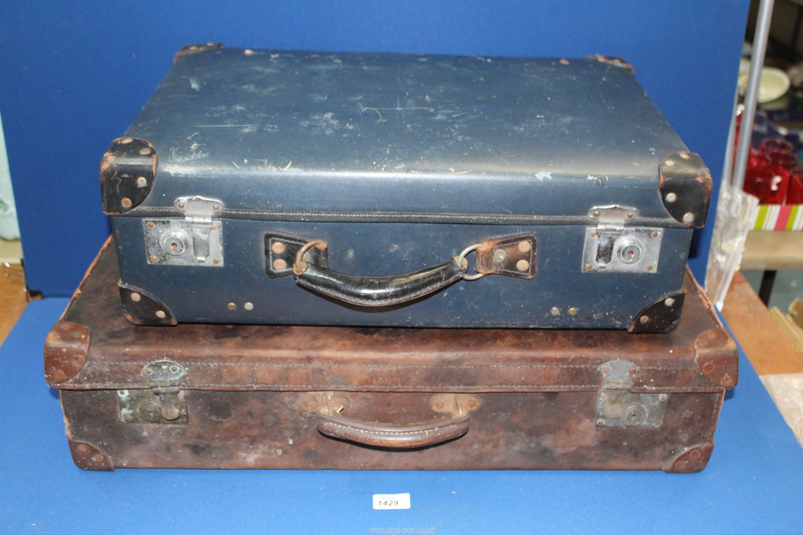A blue Antler suitcase and a brown leather suitcase, a/f.