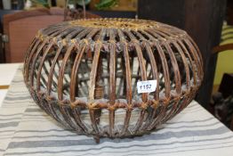 A Cane lobster pot style occasional table/Stool, 19'' diameter x 12'' tall, some damage.