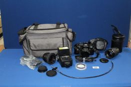 A Pentax Super A camera outfit with 50mm F1.7 lens, 135mm F2.8 lens, 28mm F2.