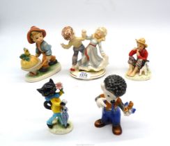 Four Goebel figures plus one similar including black cat, sitting boy with dog by Norman Rockwell,