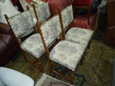 A set of four Oak framed Dining Chairs with turned front legs and "H" stretchers,