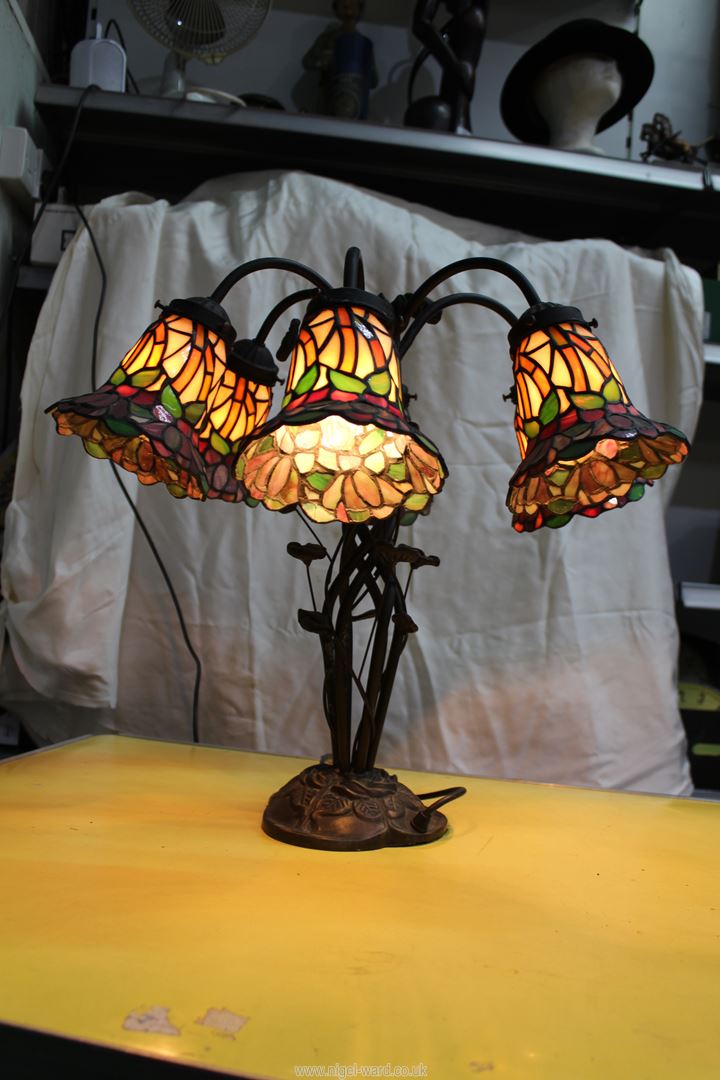 A six branch floral Tiffany style Lamp with entwined leaf base, 18 3/4'' tall. - Image 2 of 4