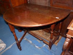 A heavy Oak oval dropleaf gate leg Dining Table,