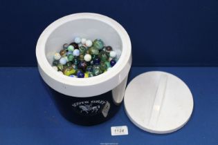 An ice bucket full of marbles.