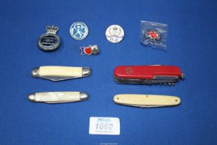 A small quantity of penknives, badges, etc.