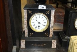 A slate and marble Mantle Clock having gold painted inset details, Roman numerals on a white face,