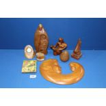 A quantity of treen including mother and child figures, watch stand etc.