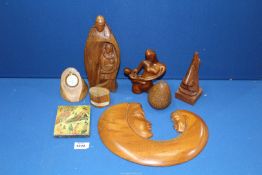 A quantity of treen including mother and child figures, watch stand etc.