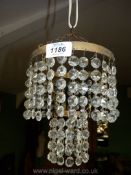 A two tier glass button light shade.