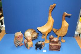 A quantity of treen animals including; ducks, owl, cats, elephant and ducklings.