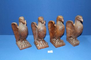 A set of four carved wooden Eagle Newel post Caps, 10 1/2'' high, all a/f.