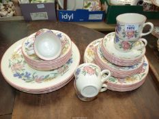 A Chelsea floral tea and dinnerware including six of each dinner, side and tea plates, bowls,