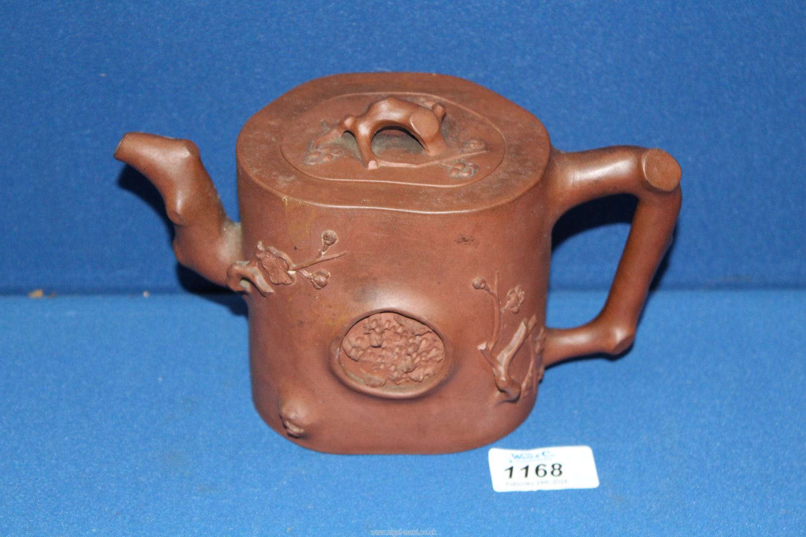 A Chinese terracotta Teapot having blossom relief, 5 1/2'' tall, lid chipped. - Image 6 of 6