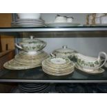 A Wedgwood Dinner service in an "Ivy" pattern, two lidded tureens, gravy boat and saucer, etc.