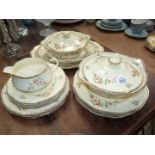 An Alfred Meakin 'Marigold Marquis' dinner service including three meat plates, two tureens,