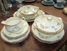 An Alfred Meakin 'Marigold Marquis' dinner service including three meat plates, two tureens,