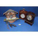 Two wooden Mantle clocks and a Cuckoo clock with weights.