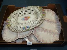 A set of four Italian serving dishes in cream with feather design,