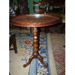 A 19th c Mahogany oval Occasional Table having a wavy edged gallery to the top and standing on a