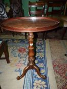 A 19th c Mahogany oval Occasional Table having a wavy edged gallery to the top and standing on a