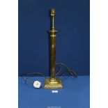 A brass effect Table Lamp with reeded column, 22'' tall.