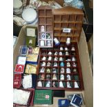 A quantity of thimbles and display shelves including Welsh Hat, Tenby, Gibraltar, Sweet pea,