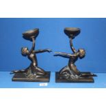 A pair of Art Deco style ''Past Times'' candle stands in the form of girls in dance pose,