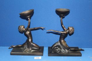 A pair of Art Deco style ''Past Times'' candle stands in the form of girls in dance pose,