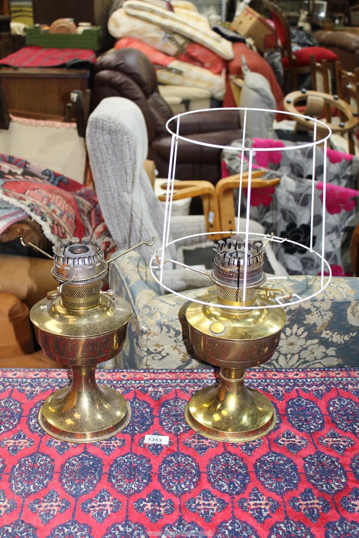 A pair of Aladdin lamps with one frame only for a paper shade, a/f.