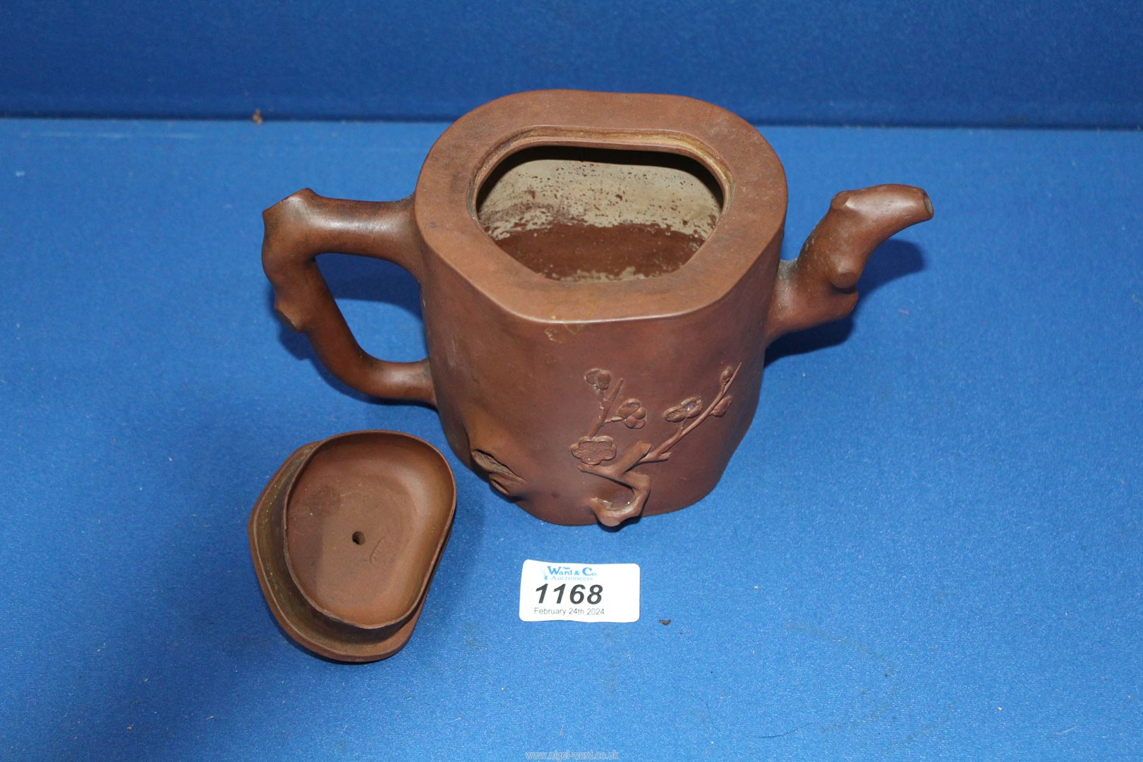 A Chinese terracotta Teapot having blossom relief, 5 1/2'' tall, lid chipped. - Image 3 of 6