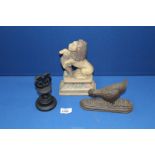 A cast iron hen doorstop 7 1/2" long, a lion cast doorstop and a string dispenser with blade.