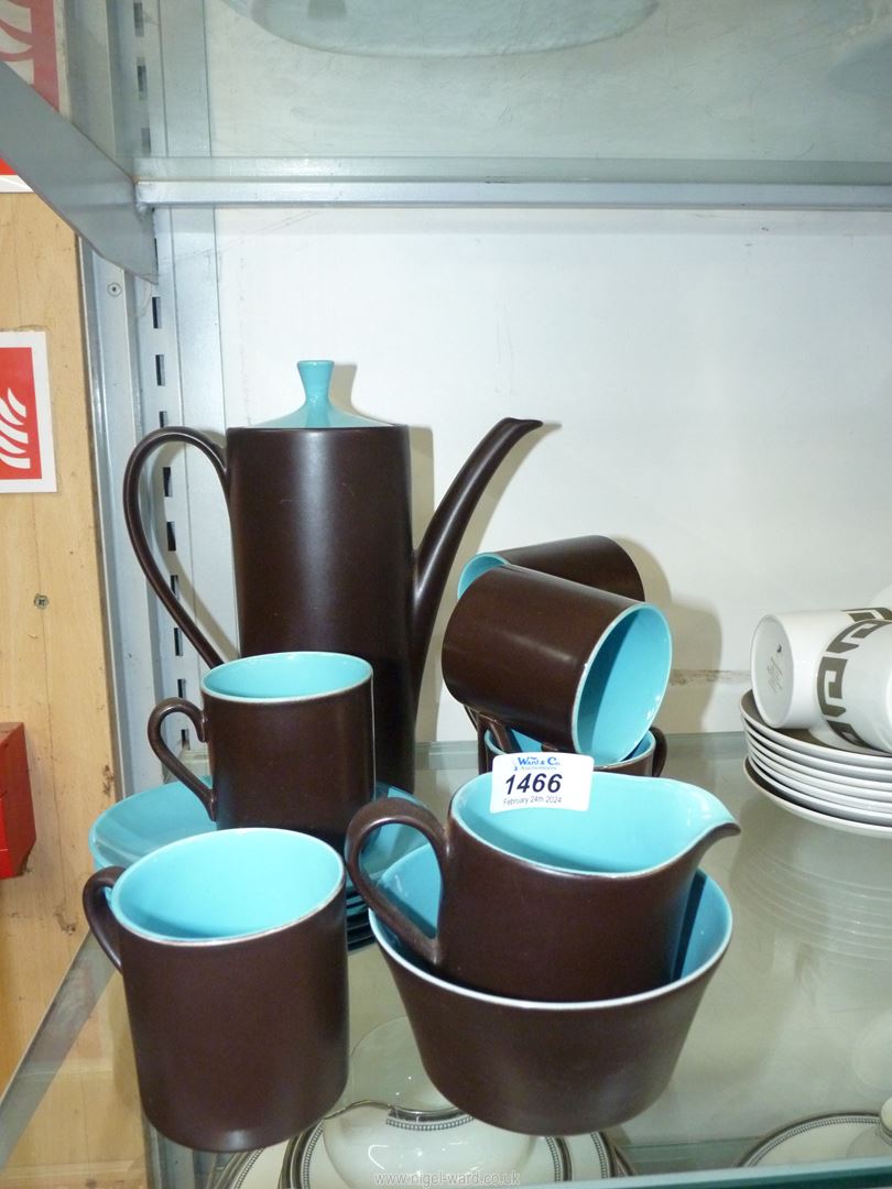 A Myott coffee set in matt chocolate brown having bright blue interior;